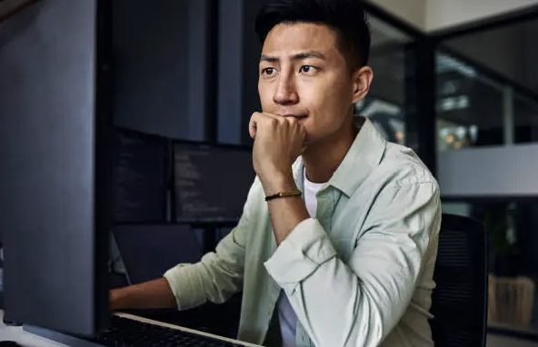 Analyst at a monitor at night